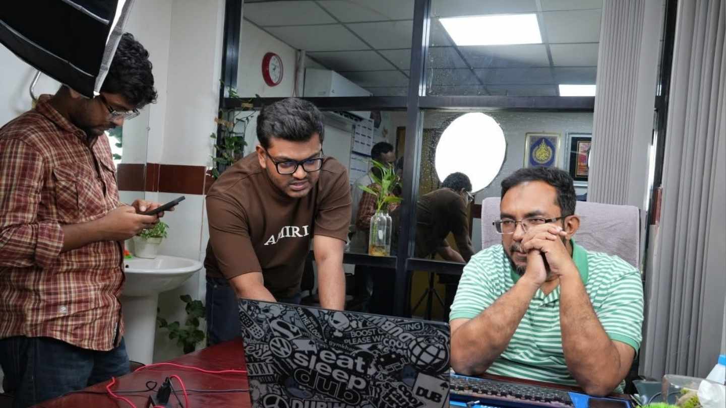 Reviewing website work with a doctor at his desk